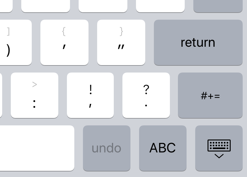 A close up on the 'close keyboard' key in the bottom right-hand corner of the on-screen keyboard